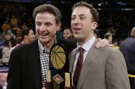 Rick Pitino poses with his son Richard Pitino Jr at a basketball tournament.